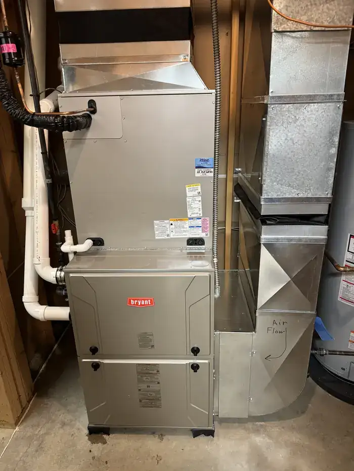 A Bryant furnace with a new evaporator coil and ductwork above it